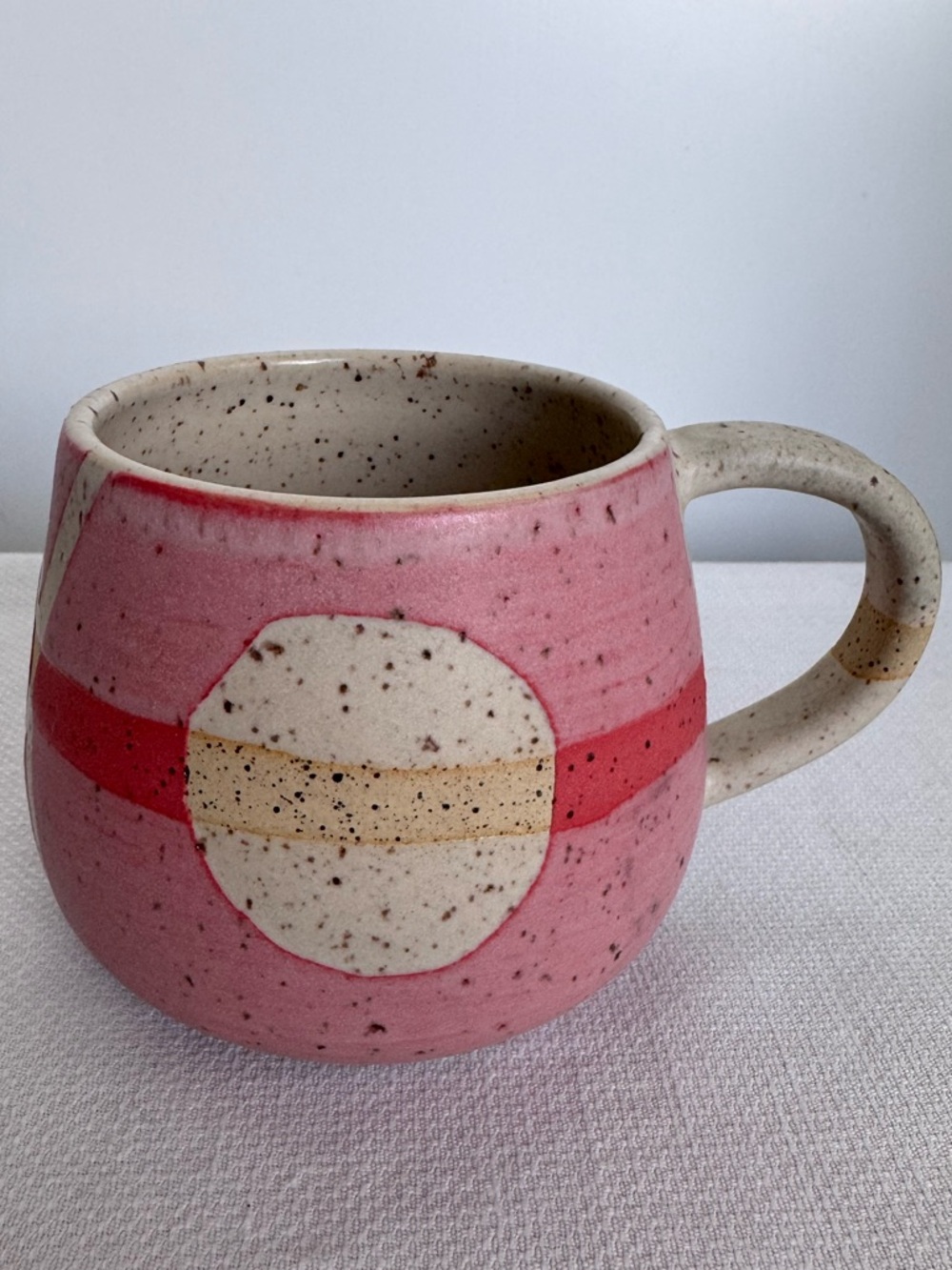 Hand thrown pink pottery mug